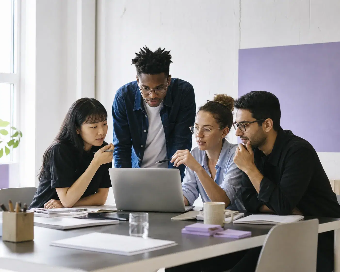 A global Expert Hire team collaborating in a bright office