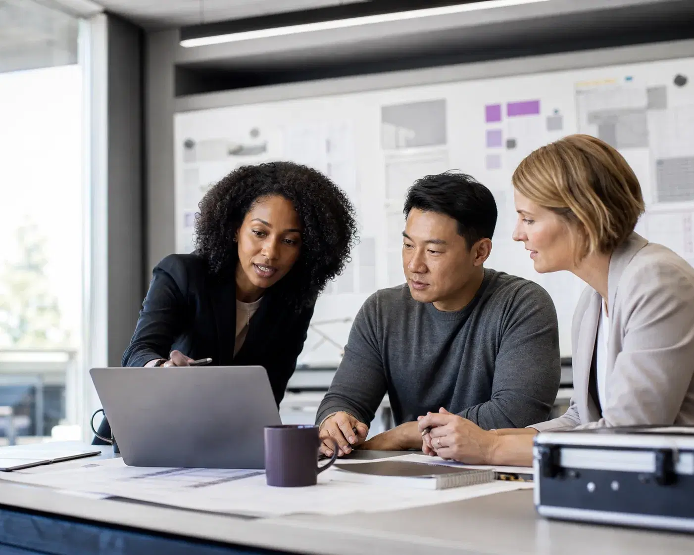 A cross-functional team coordinating a hiring and delivery workflow